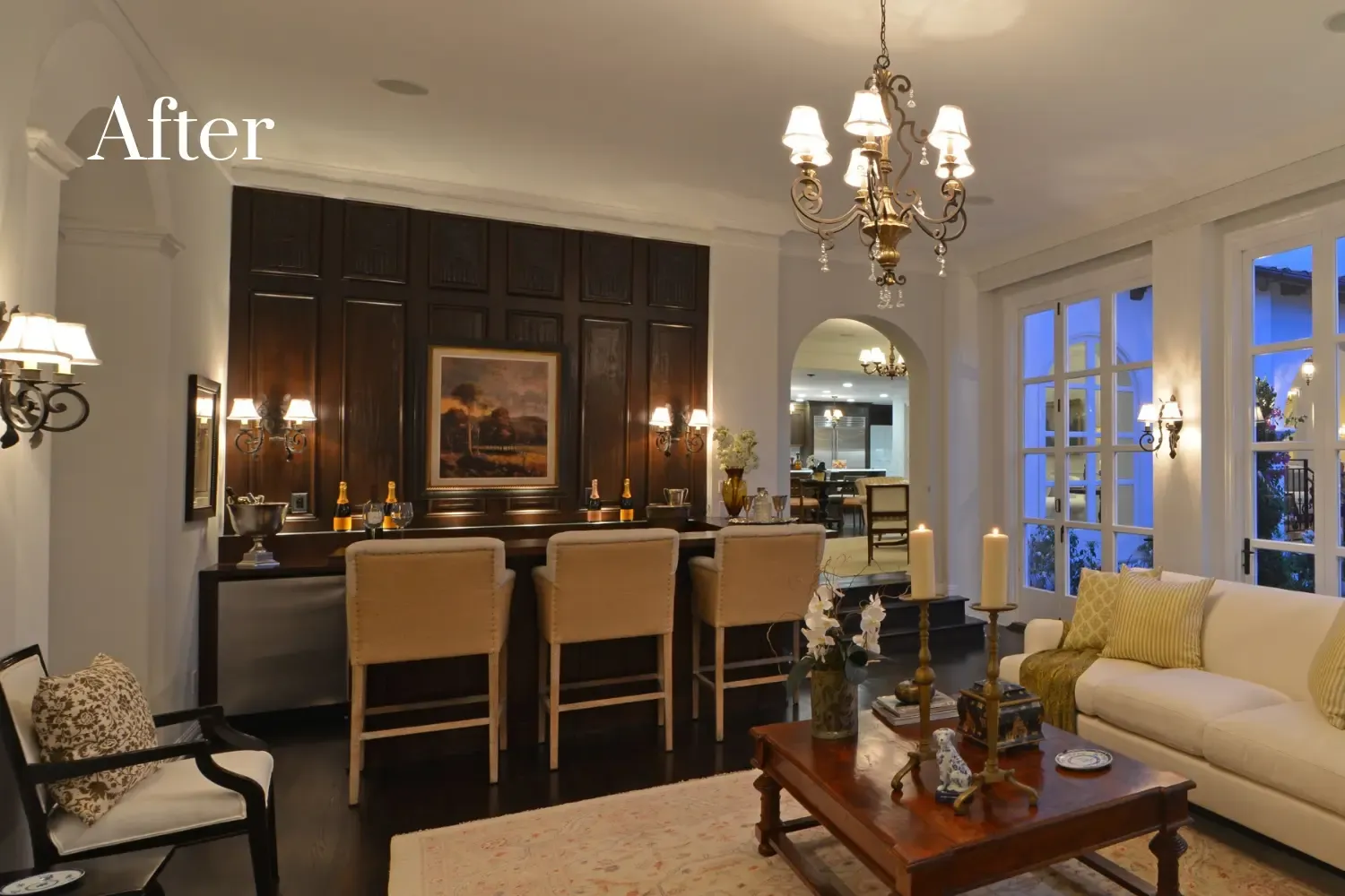 Lounge and wet bar after remodel — coffered ceilings, built-in bar, and open sightlines