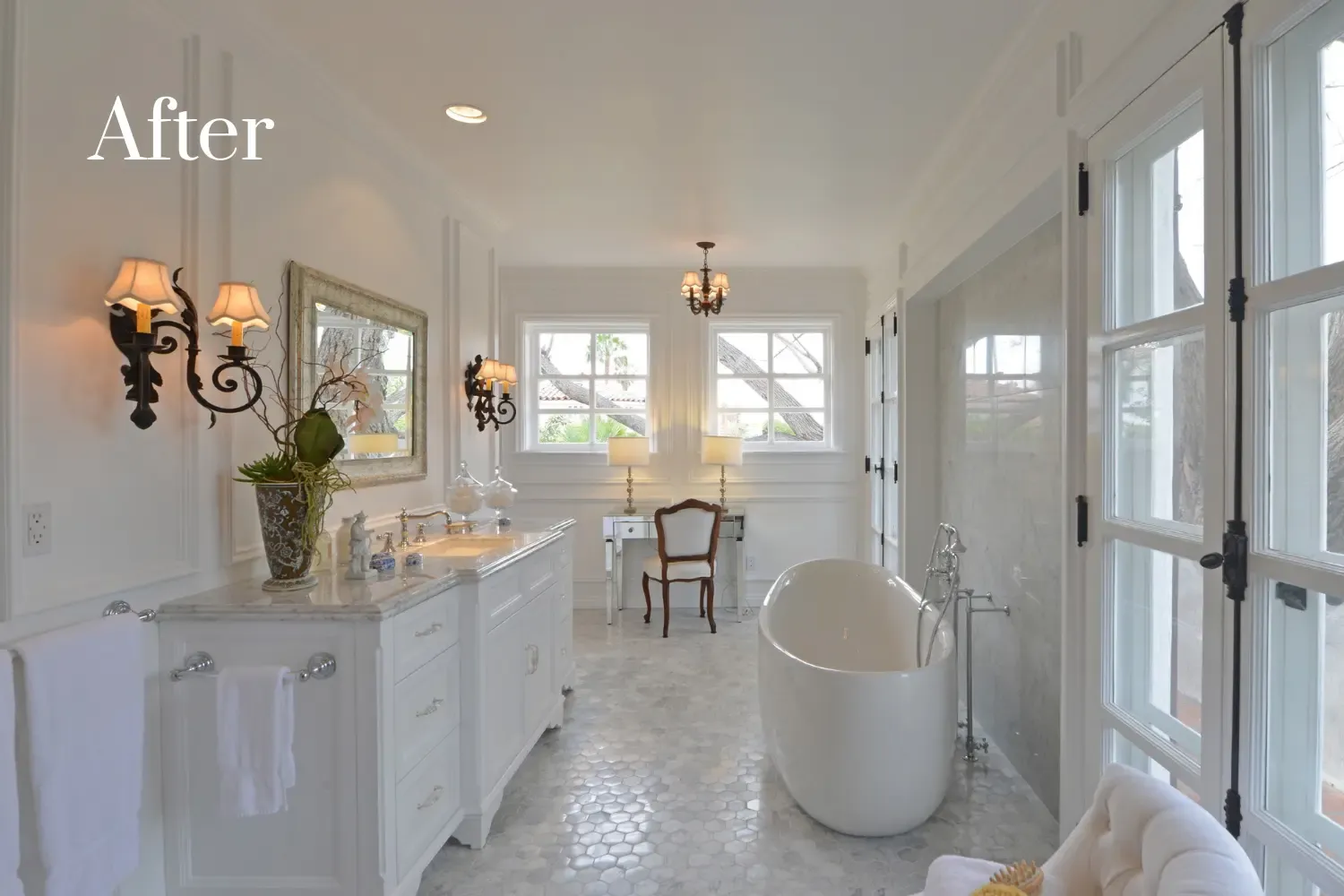 Bathroom after remodel — spa-like retreat with marble flooring and freestanding tub